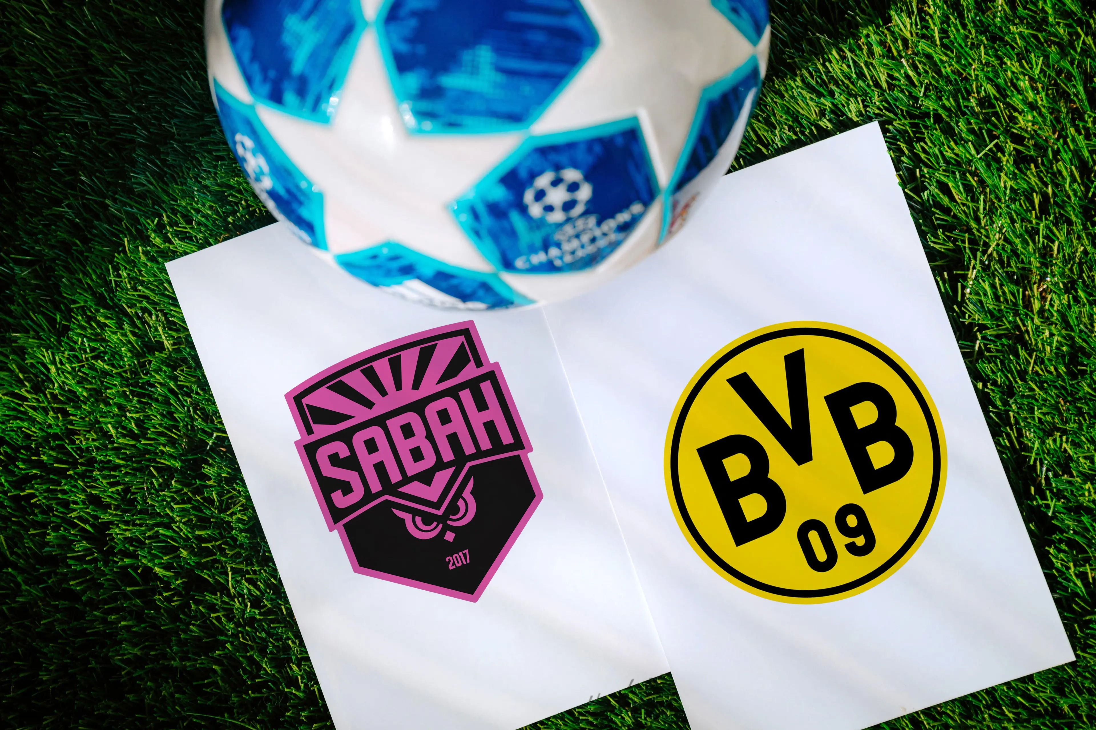 Grafik zur Champions-League-Partie zwischen Sabah und Borussia Dortmund mit den beiden Mannschaften.